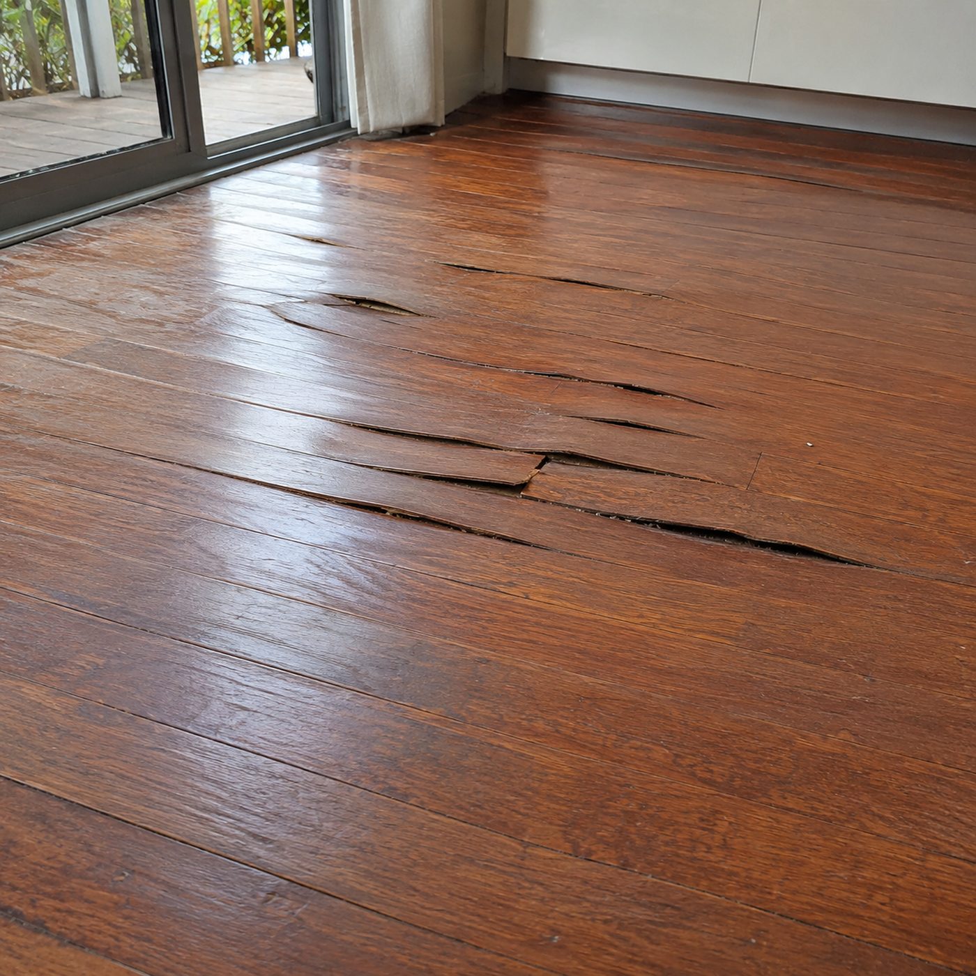 Water-damaged timber floorboards cupping